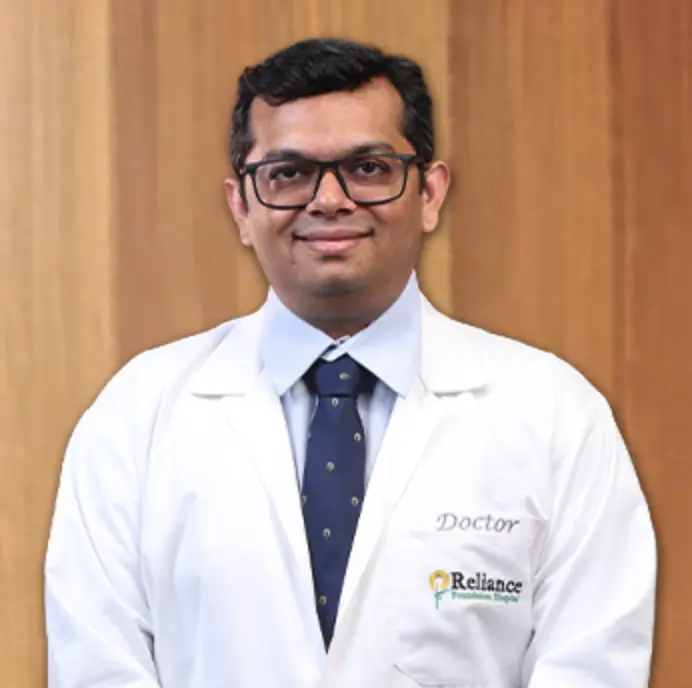Dr. Giriraj Gandhi, plastic and reconstructive surgeon in Pimpri-Chinchwad, in a white doctor's coat