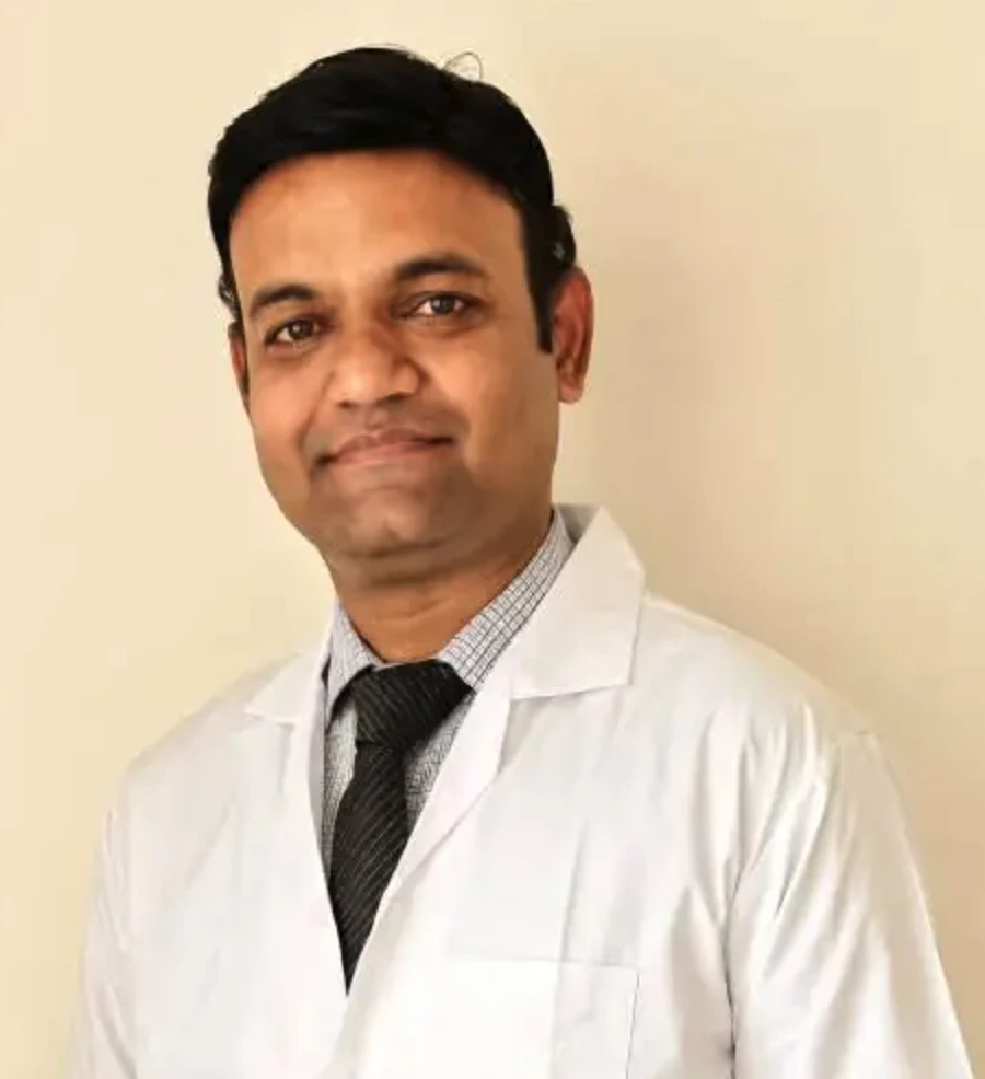 Dr. Rahul Bhadgale, plastic and reconstructive surgeon in Pune, in a white doctor's coat