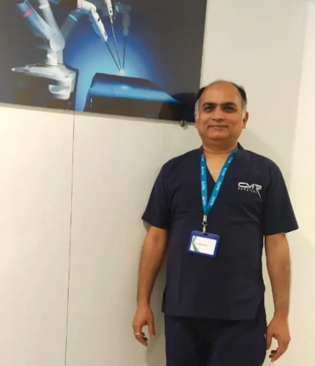 Dr Vijay Pandey, laparoscopic and robotic surgeon, in surgical scrubs
